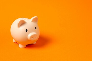 Piggy coin bank on colored background for money savings, financial security or personal funds concept.