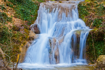 beautiful small  waterfall on mountain river