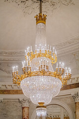 Antique gilded crystal huge ceiling chandelier in palace baroque style. Chandelier in the opera...
