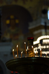 Candles inside the Naval Nikolsky Cathedral. Kronstadt.