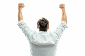 Man in white shirt, arms raised, victorious pose.