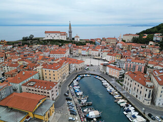 Fototapeta premium Aerial view of Piran, Slovenia, Europe. European town skyline with pier, central square, hotels and restaurants.