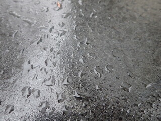 rain drops on a grey surface