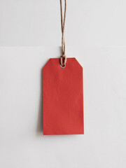 Blank product tag with cord, isolated on white. Ideal for retail, promotional events, or gifting. Plenty of space for text to highlight sales, discounts, or holiday offers.