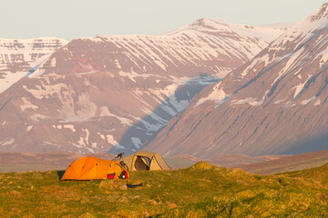 two tents in the shine of the midnight sun in iceland