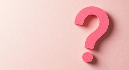 Bright pink question mark on a soft pastel background inviting curiosity and contemplation