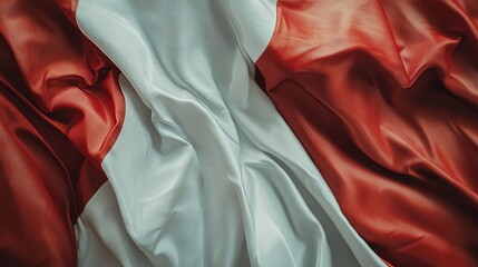 Obraz premium Close-up of a red and white fabric with folds and wrinkles.