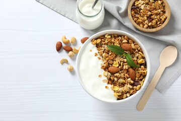 Delicious granola with yogurt on a light background
