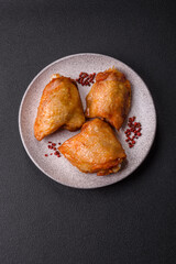 Chicken thighs fried with salt, spices and herbs
