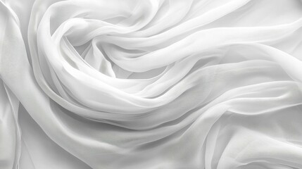 This image showcases a soft, sheer white fabric elegantly swirling in folds, highlighting its delicate texture and fluidity.