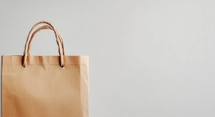 Folded Brown Paper Bag with Handle Against White Background - Ideal for Grocery Shopping and Packaging Needs