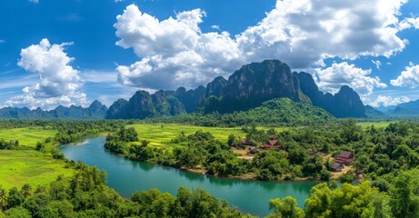 Naklejka premium Aerial View of Lush Green Mountains with River Under Blue Sky