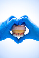 Full-arch porcelain implant-supported dental prosthesis for edentulous jaws with All-on-X and...