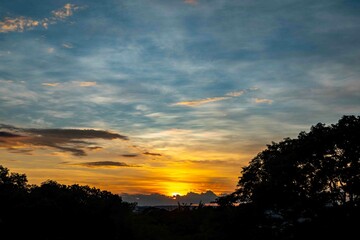 Sunrise with intense natural orange lights and idyllic dramatic scenery