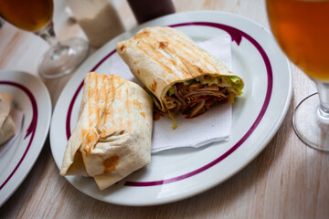 Close-up of cut tasty shawarma with chopped vegetables and greens, nobody