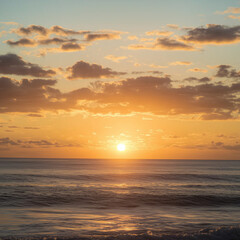 Naklejka premium Coastal sunrise over the ocean, soft waves catching the warm golden light