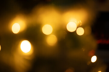 bokeh lights on a Christmas tree holiday background