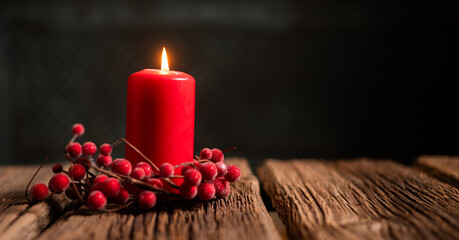  red Christmas Candle on rustic wood