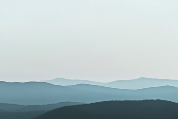 minimalist, photography, a minimalist mountain range with crisp lines and sparse vegetation, distant view.