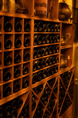photo Explore this elegant wine cellar with an extensive collection of wine bottles perfectly organized in wooden racks, showcasing timeless craftsmanship and sophistication