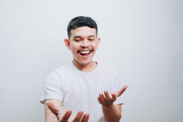 Joyful Young Man with Open Hands Against White Background A Portrait of Happiness and Generosity