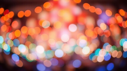 Fototapeta premium a vibrant and blurry orange bokeh background with soft focus lights, glowing, bright