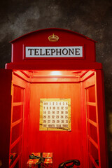 Obraz premium telephone booth, red in the interior