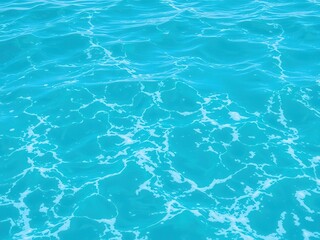 Obraz premium Close-up shot of the pure blue turquoise water of the ocean, featuring foam and waves, texture, nature, tranquil