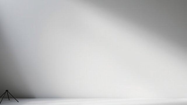 Gray background with soft, diffused lighting creating elegant shadows for product presentation, background, presentation