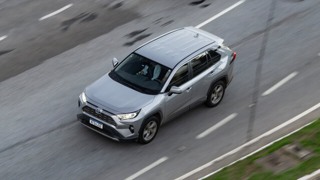 Silver Toyota Rav4 in movement, Luxury SUV on city highway, High Resolution