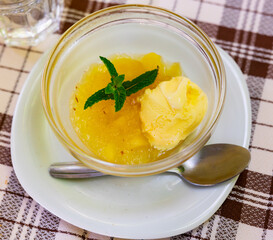 Sweet apple compote served with vanilla ice cream for dessert