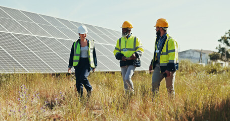 Business people, technician and walking with team for solar panel installation, photovoltaic...