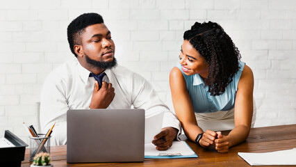 Attractive black guy sexually harassed by his female collague at workplace. Panorama