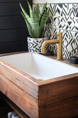 Modern Wooden Bathroom Sink With Gold Faucet And Plant