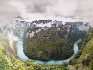 steep cliffs of Sumidero Canyon in Chiapas, Mexico, showcasing adventure tourism and dramatic...
