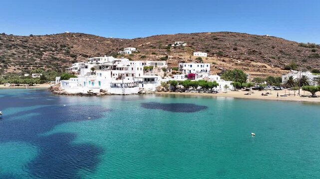 Aerial drone cinematic video of famous and picturesque seaside fishing village and beach of Faros, featuring beaches of Fasolou and Vlycho, Sifnos island, Cyclades, Greece