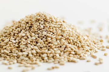 Fototapeta premium Close up of a pile of white sesame seeds on a white surface