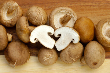 Fresh shiitake mushrooms on white background.