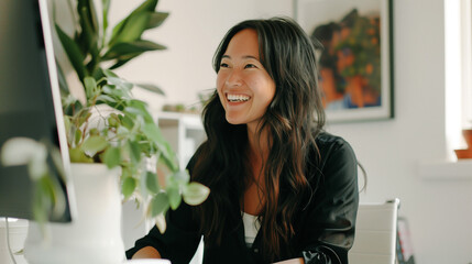 Happy young woman working remotely on a virtual video team meeting call, remote work and flexible culture concept. Inclusive and diverse dei workplace with a blasian african american businesswoman