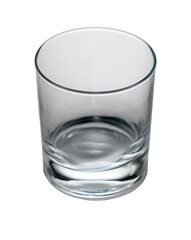 Clear glass tumbler resting on a clean surface, reflecting light delicately in a bright room