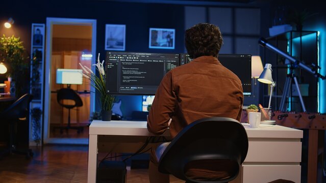 Engineer arriving in home office with mug of coffee in hand, ready to start coding using javascript. IT expert beginning remote work shift, holding cup of tea, updating company software, camera B