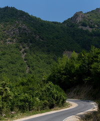 Rhodopes, are a mountain range in Southeastern Europe. Bulgaria. Panorama. The forest area covers the mountains.