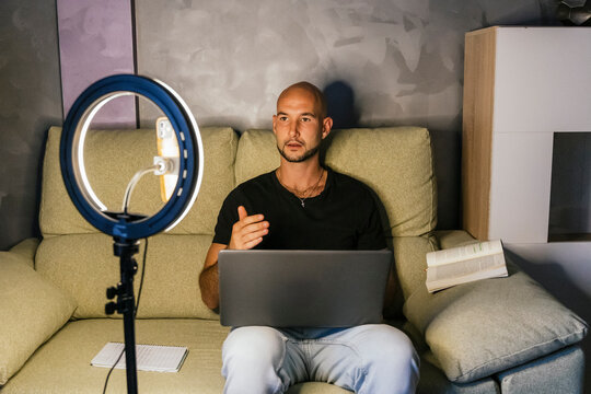 Content creation for social media with laptop and ring light