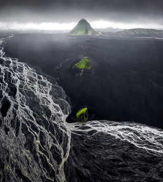 Mystical Icelandic landscape with volcanic mountain and vast river