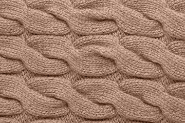 Knitted pattern in trending color of year 2025.