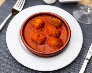 Appetizing dish of meatballs with tomato sauce served on platter