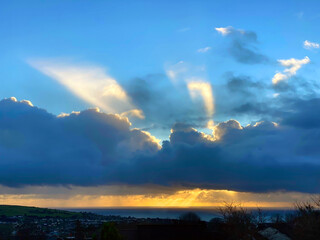 Isle of Man sunrise with stormy clouds and sun's rays