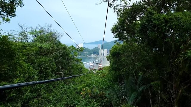 Cable car of Sao Vicente - SP, Brazil. Landscape going down the cable car with the view to Itarare Beach and Porchat Island. Coast of Sao Paulo state.