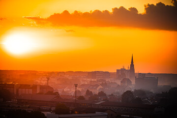 Naklejka premium Sunset over Osijek, Croatia with vibrant colors illuminating the skyline