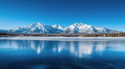Serene Frozen Lake Surrounded by Majestic Snow-Capped Mountains